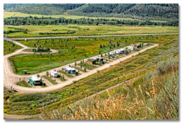 Wide view of the Yampa Valley meadow and mountains from the hillside above Eagle Soaring RV Park
