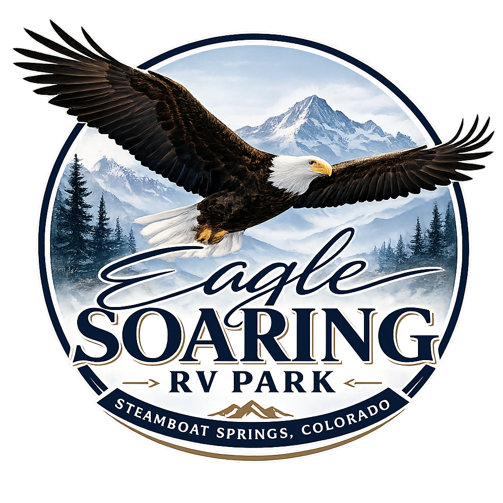 Eagle Soaring RV Park crest, a bald eagle in flight over the Rocky Mountains