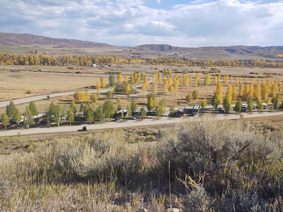 RV sites next to the restroom and shower building and a picnic table at Eagle Soaring RV Park